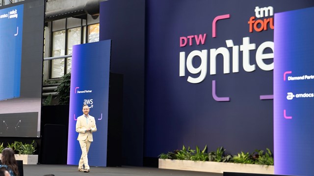 TM Forum’s VP of innovation, Aaron Boasman-Patel, on stage at the industry body’s DTW Ignite event in Copenhagen
