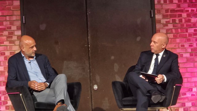VodafoneThree’s Andrea Dona (left) is interviewed by Ericsson's Patrick Johansson (right) at a media briefing in London. 