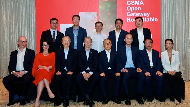 Representatives of China's three major mobile operators pose for a picture with GSMA executives at an Open Gateway round table in Shanghai.