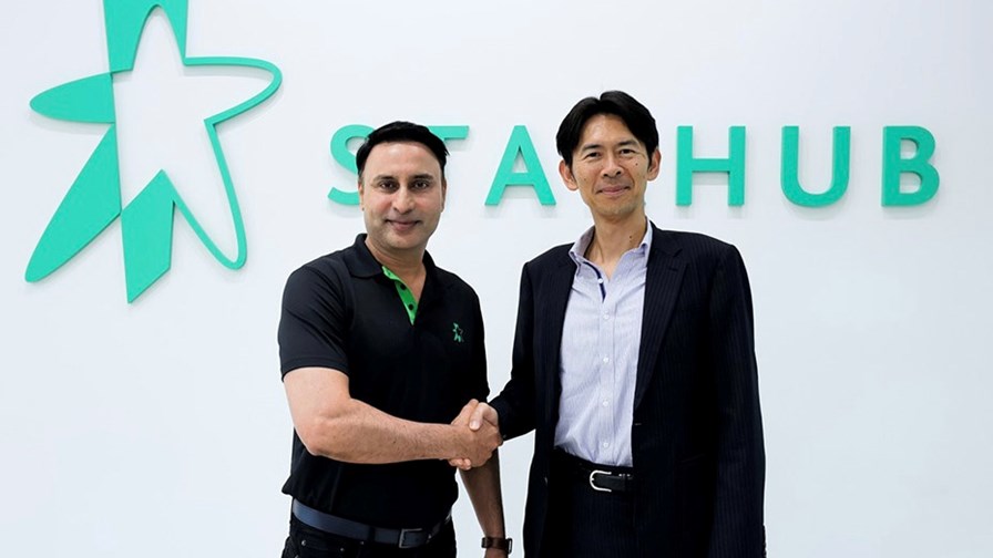 StarHub CTO Ayush Sharma (left) greets Sadayuki Abeta, NTT Docomo’s chief Open RAN strategist and CTO of Orex SAI, at StarHub’s offices in Singapore.