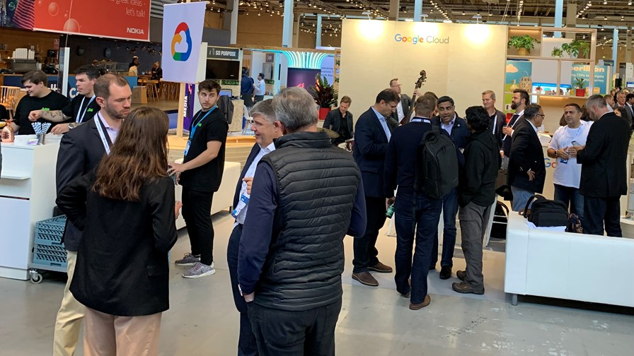 The Google Cloud booth at DTW 2022 complete with love band and cocktail bar (which all booths should have, of course).