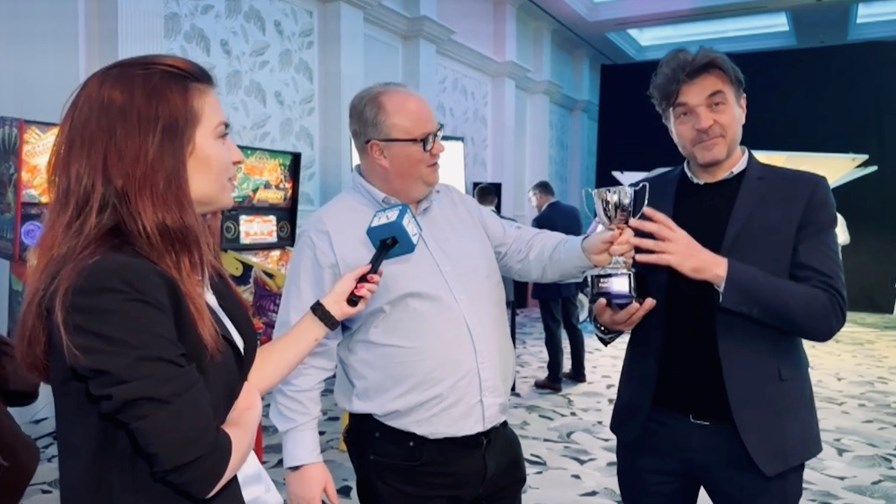 Luca Claretti (right), VP of service providers, Europe, at Juniper Networks receives the pinball wizard 2023 trophy from Neil McRae. Luca Claretti (right), VP of service providers, Europe, at Juniper Networks receives the pinball wizard 2023 trophy from Neil McRae.