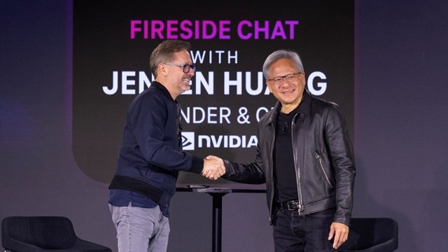 T-Mobile US CEO Mike Sievert (left) shakes on the AI-RAN innovation deal with Nvidia's CEO Jensen Huang (right). 