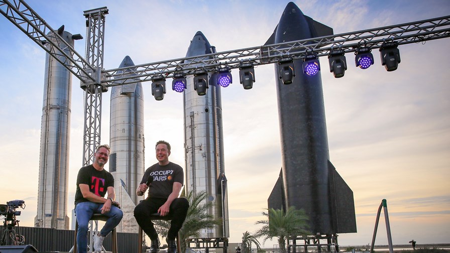 T-Mobile US CEO Mike Sievert (left) buddies up with SpaceX chief Elon Musk (right) at the Starbase facility in Texas.