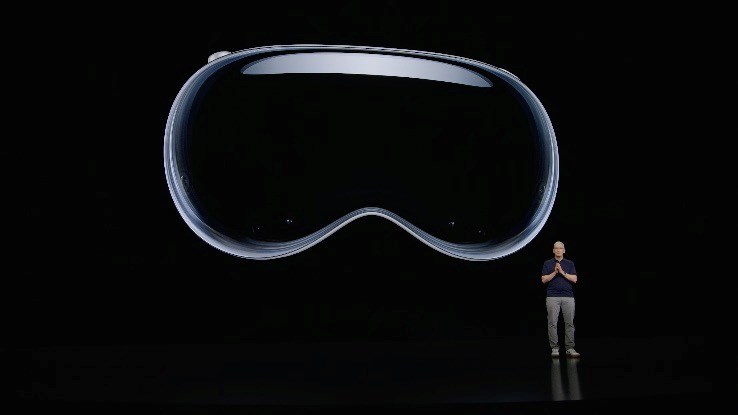 Apple CEO Tim Cook introduces the Vision Pro during the company's Worldwide Developers Conference 2023 (though fortunately the actual device is not that large in reality...) Apple CEO Tim Cook introduces the Vision Pro during the company's Worldwide Developers Conference 2023 (though fortunately the actual device is not that large in reality...)