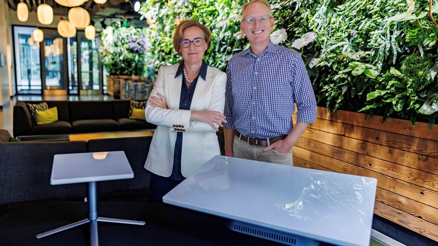 Margherita Della Valle, Vodafone Group CEO, and Dave Limp, Amazon senior vice president of devices and services. The customer terminal antennas featured are used to send and receive data to and from Project Kuiper satellites.